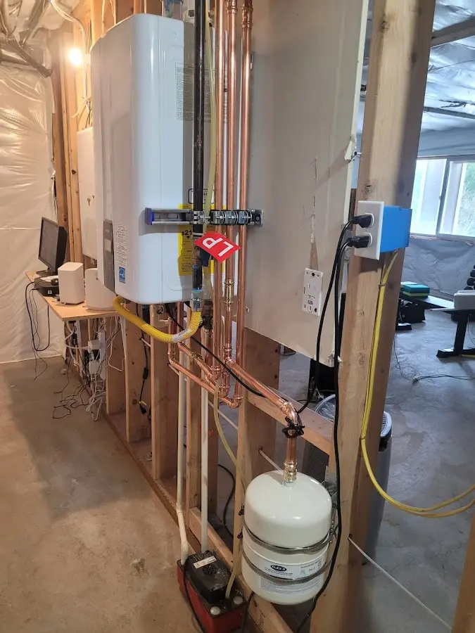 Licensed plumber repairing a kitchen sink in Weston